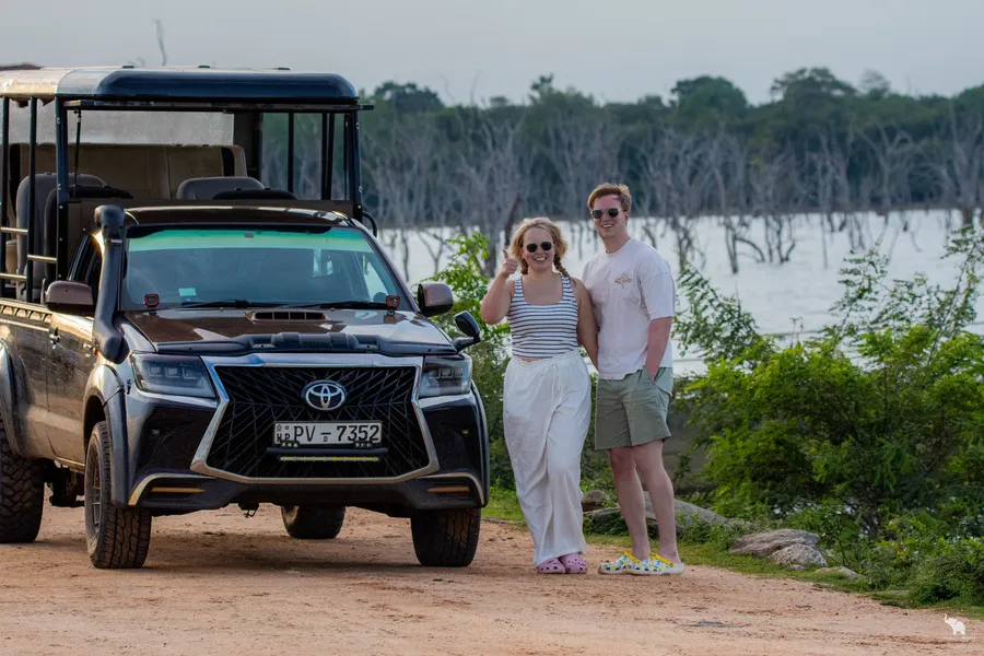 Safari guests with jeep at the open waterscape of Yala Block 6